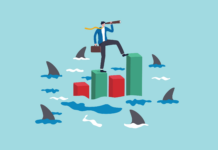 Illustration of a businessperson surrounded by sharks
