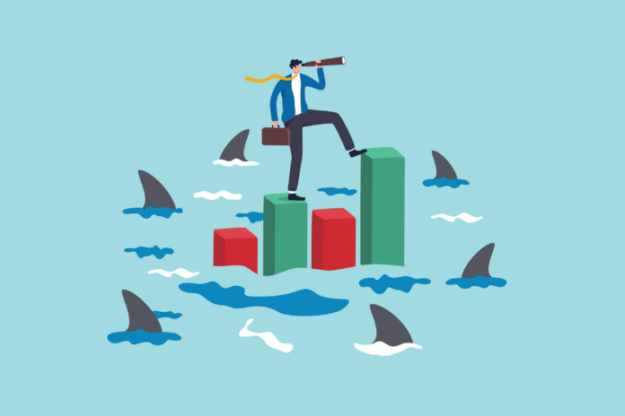 Illustration of a businessperson surrounded by sharks