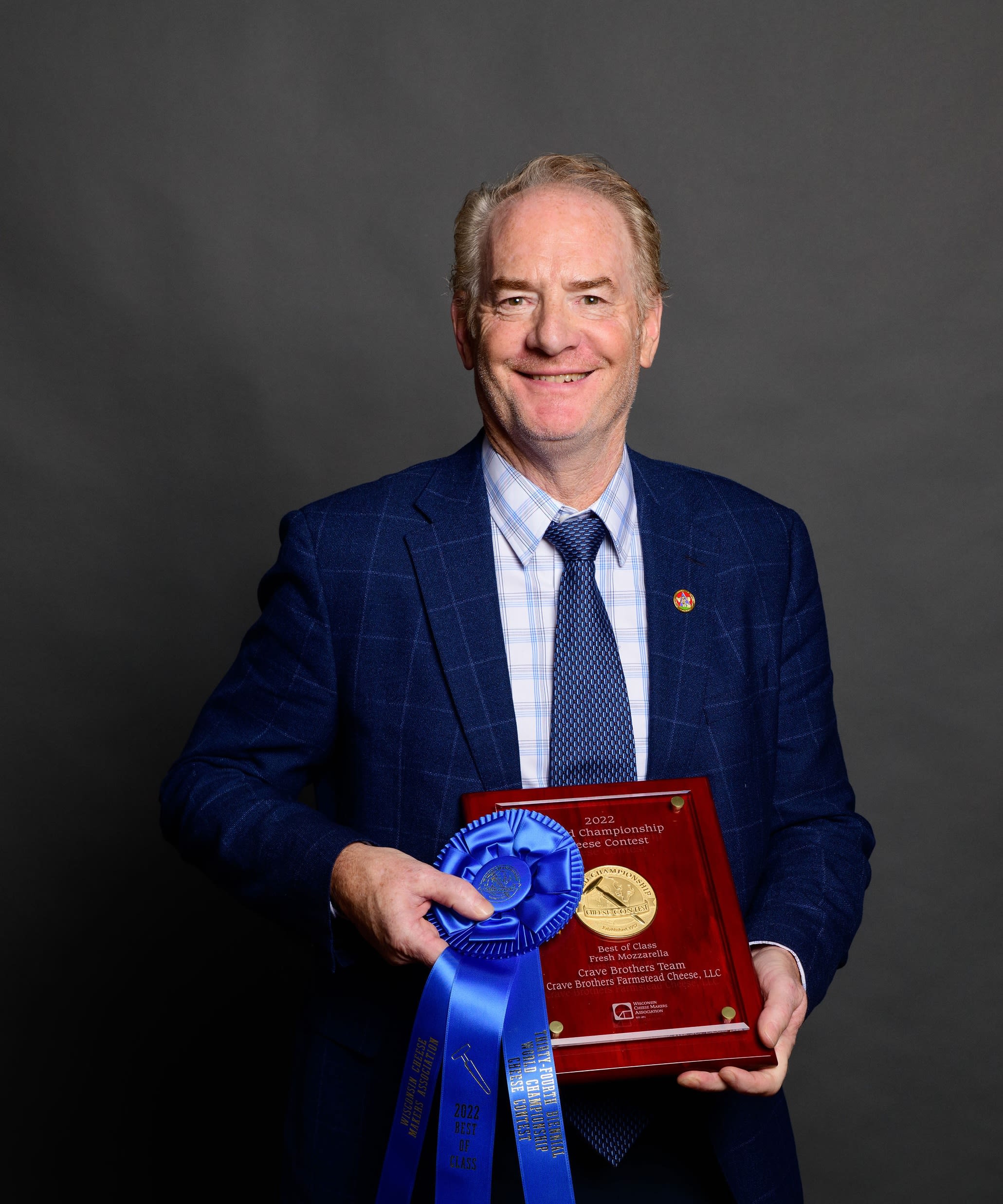 George Crave with the 2022 World Champion Cheese award