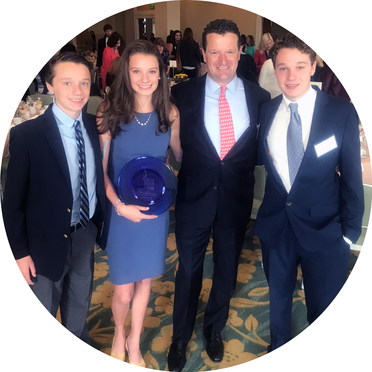 Mark DeMichaelis and his children, [L-R] John Charles, Olivia and Mark Jr at the Women Fighting Hunger Awards, which Olivia won in 2018